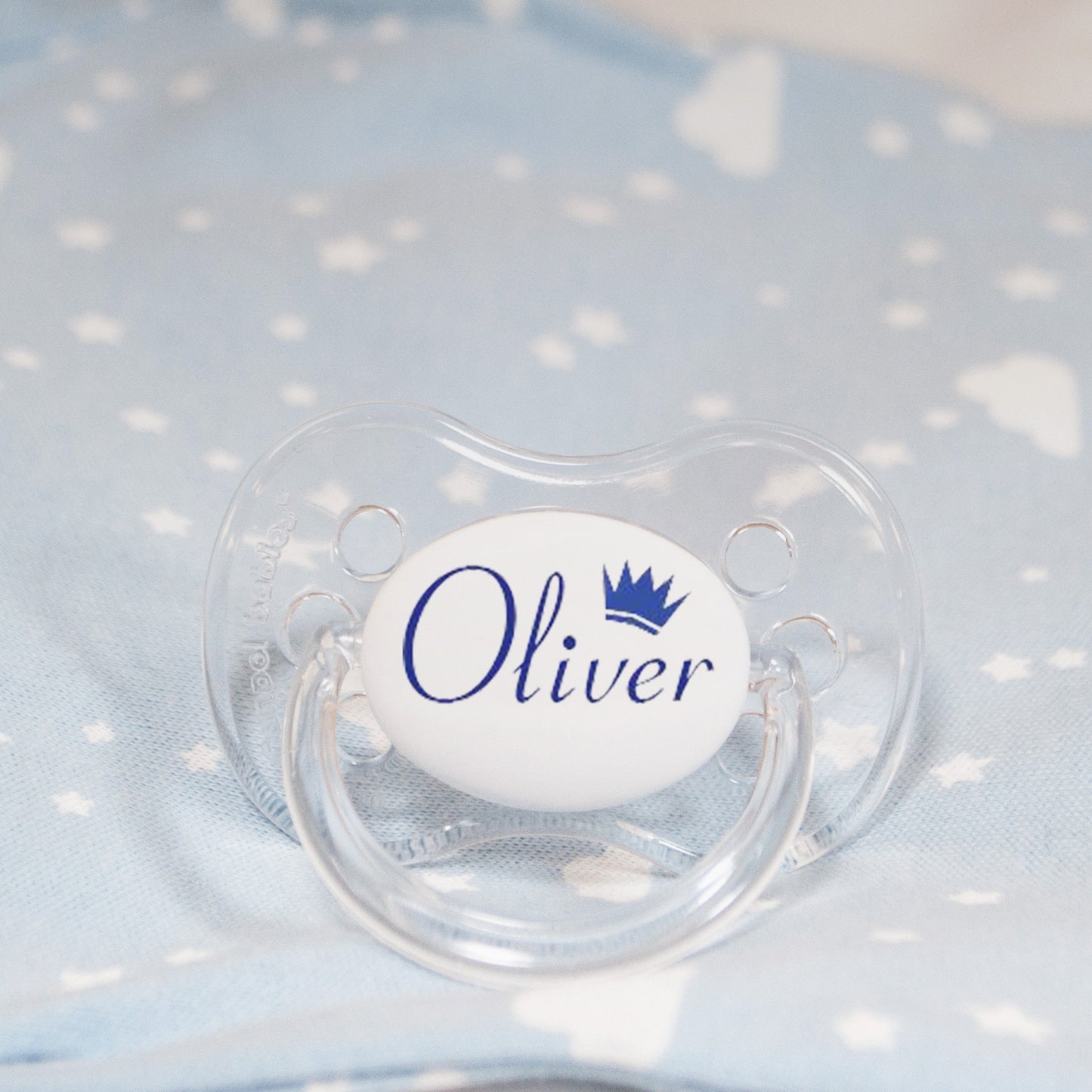 Personalised baby dummy with blue name and crown