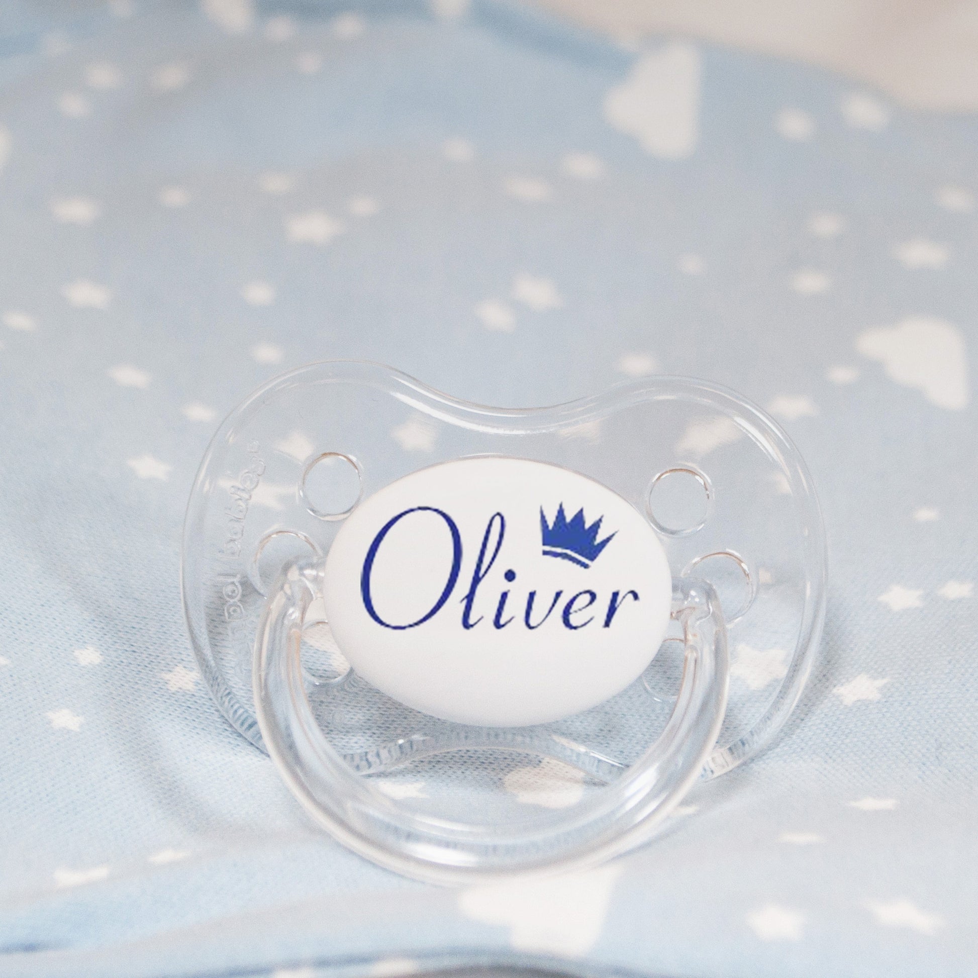 Personalised baby dummy with blue name and crown